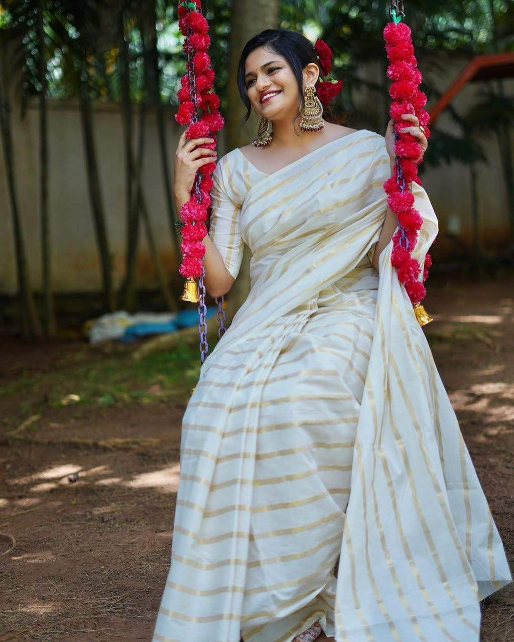 Cotton golden lines saree with tussels