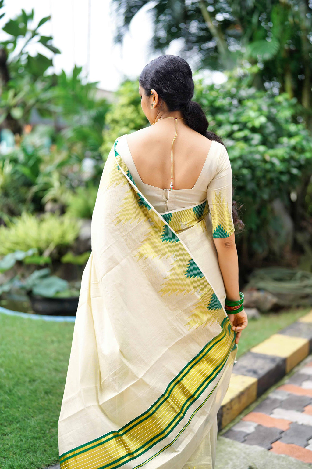 Temple golden tissue saree bottle green