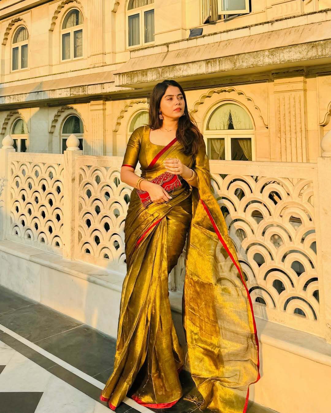 Red border golden tissue saree