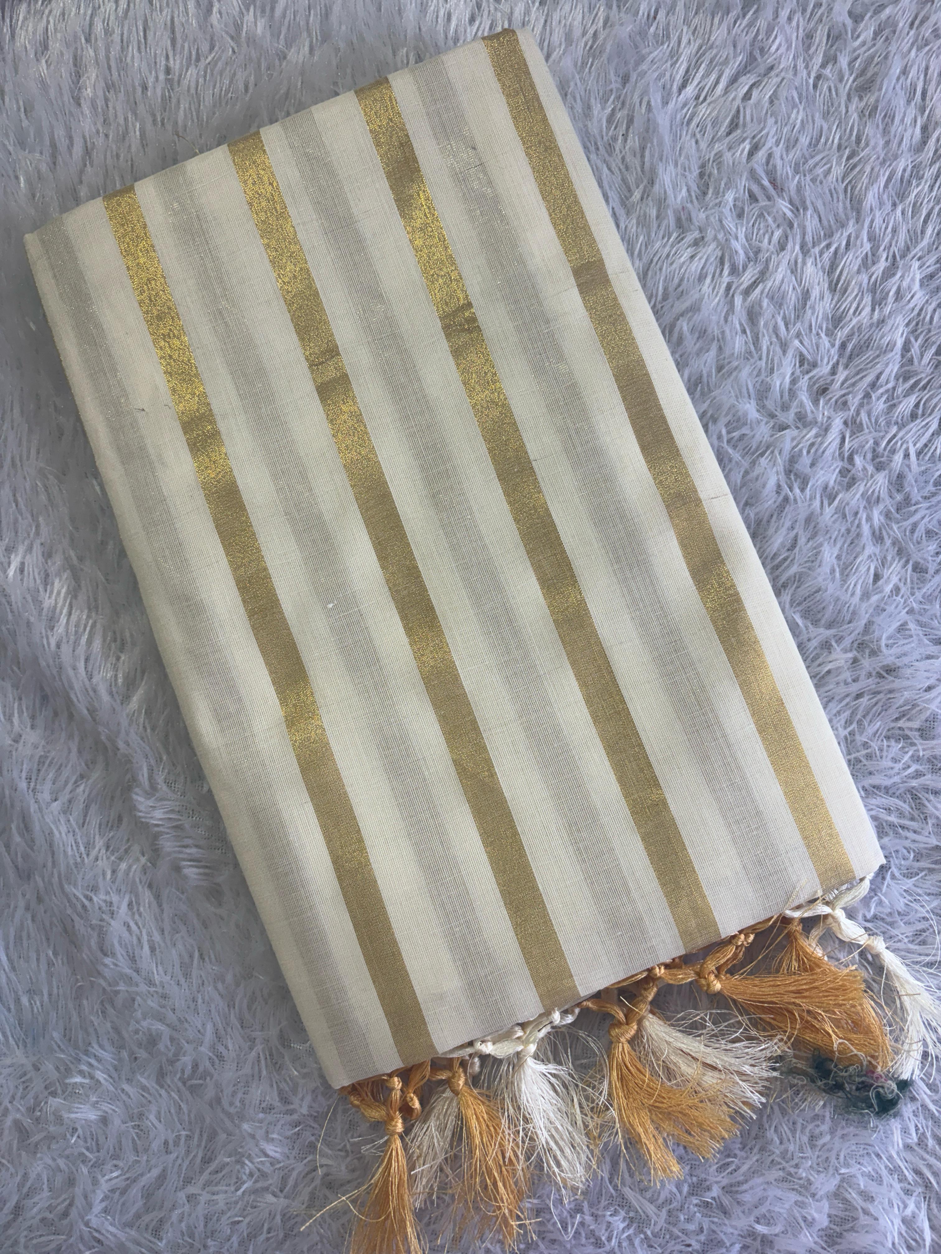 Cotton golden lines saree with tussels