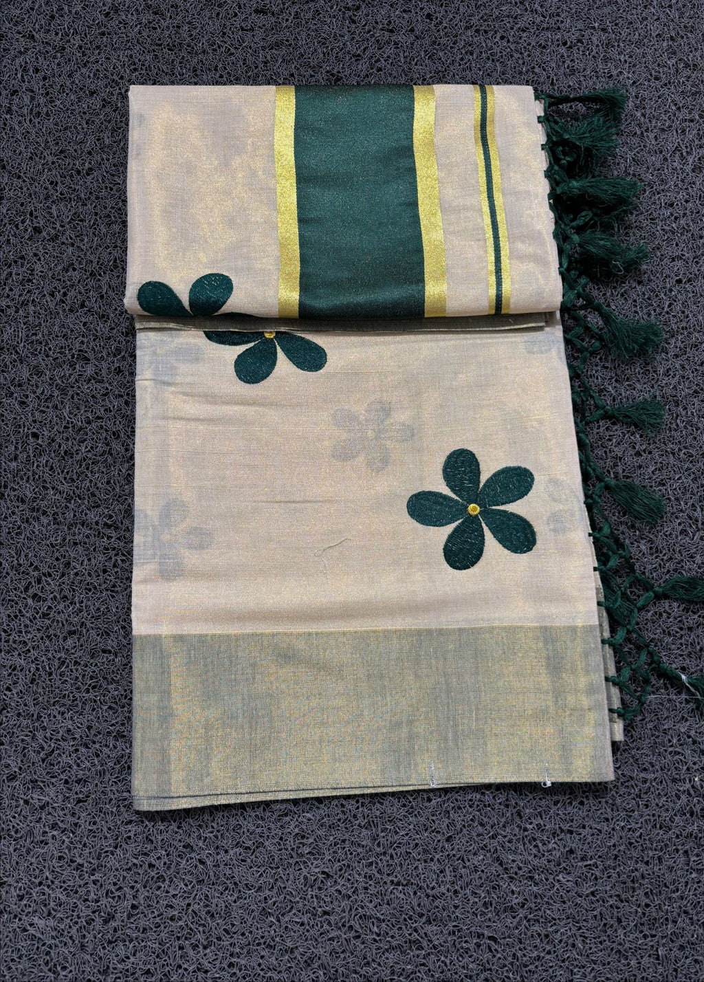 Green flower embro golden tissue saree with tussles