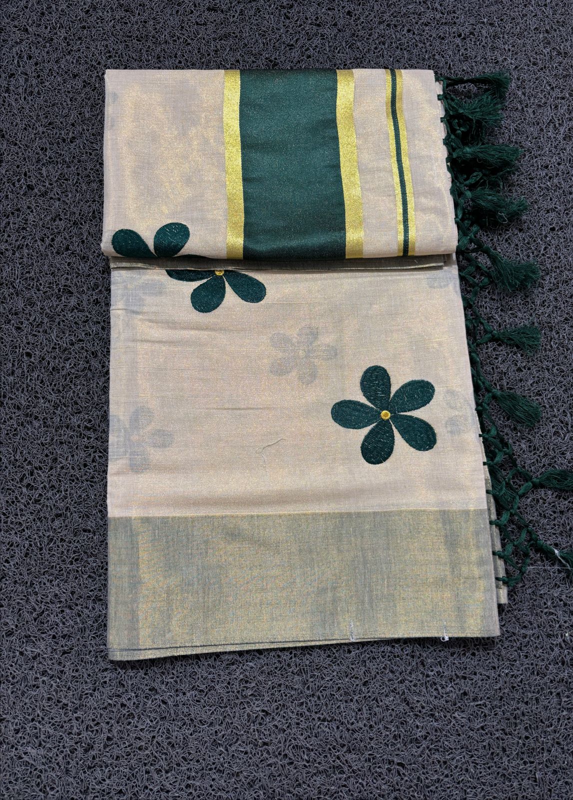 Green flower embro golden tissue saree with tussles