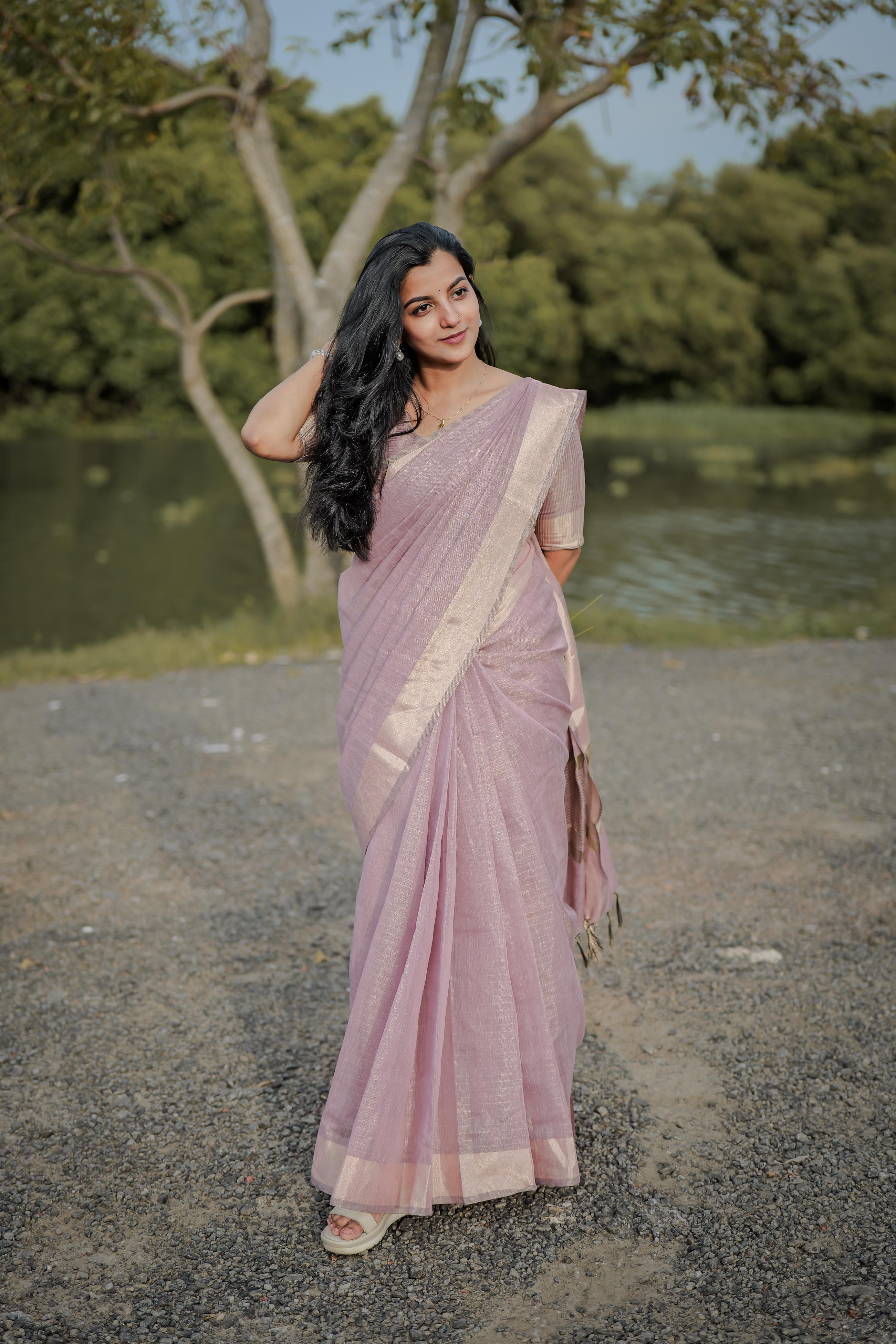 Tissue checks pastel shade saree with tussles
