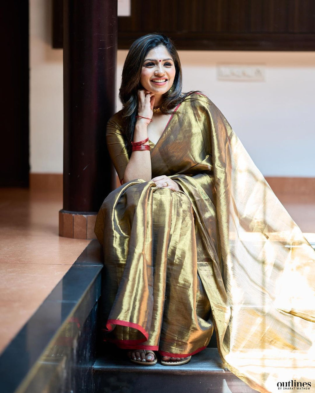 Red border golden tissue saree