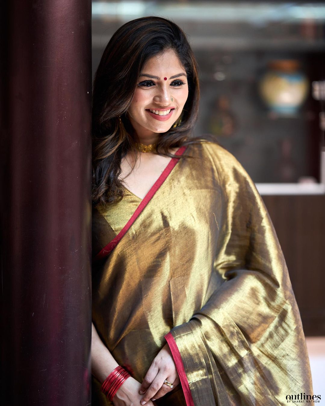 Red border golden tissue saree