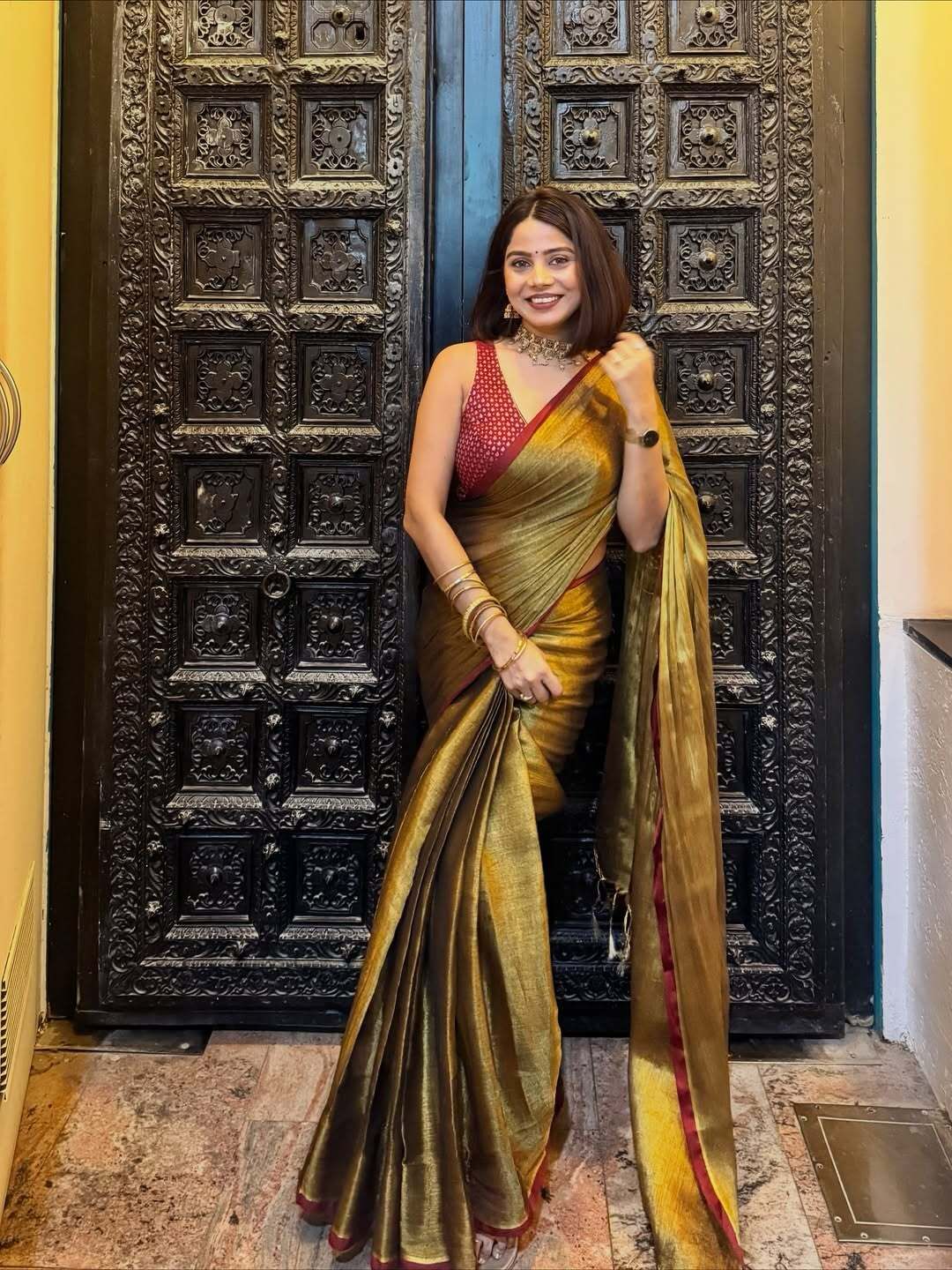 Red border golden tissue saree