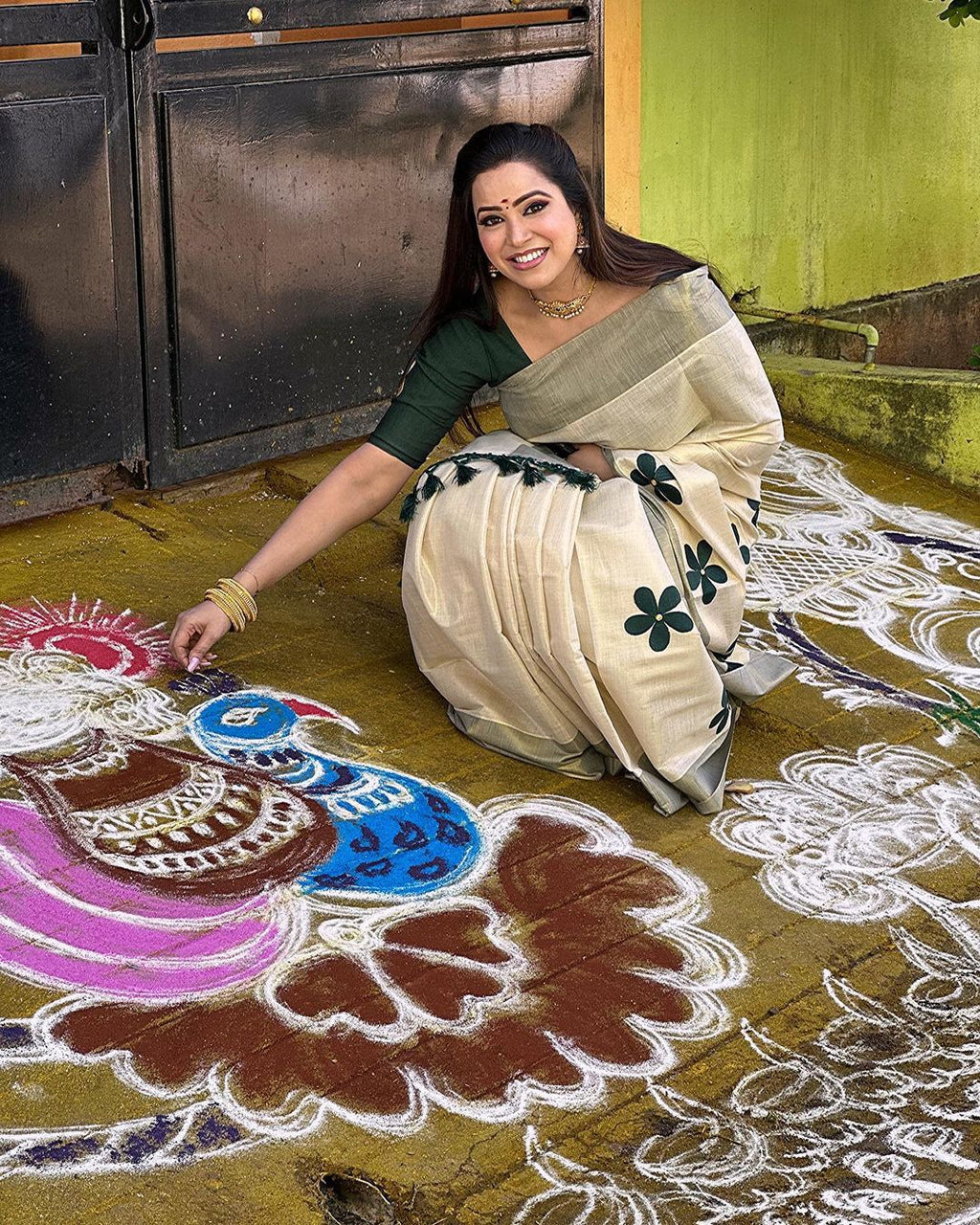 Green flower embro golden tissue saree with tussles