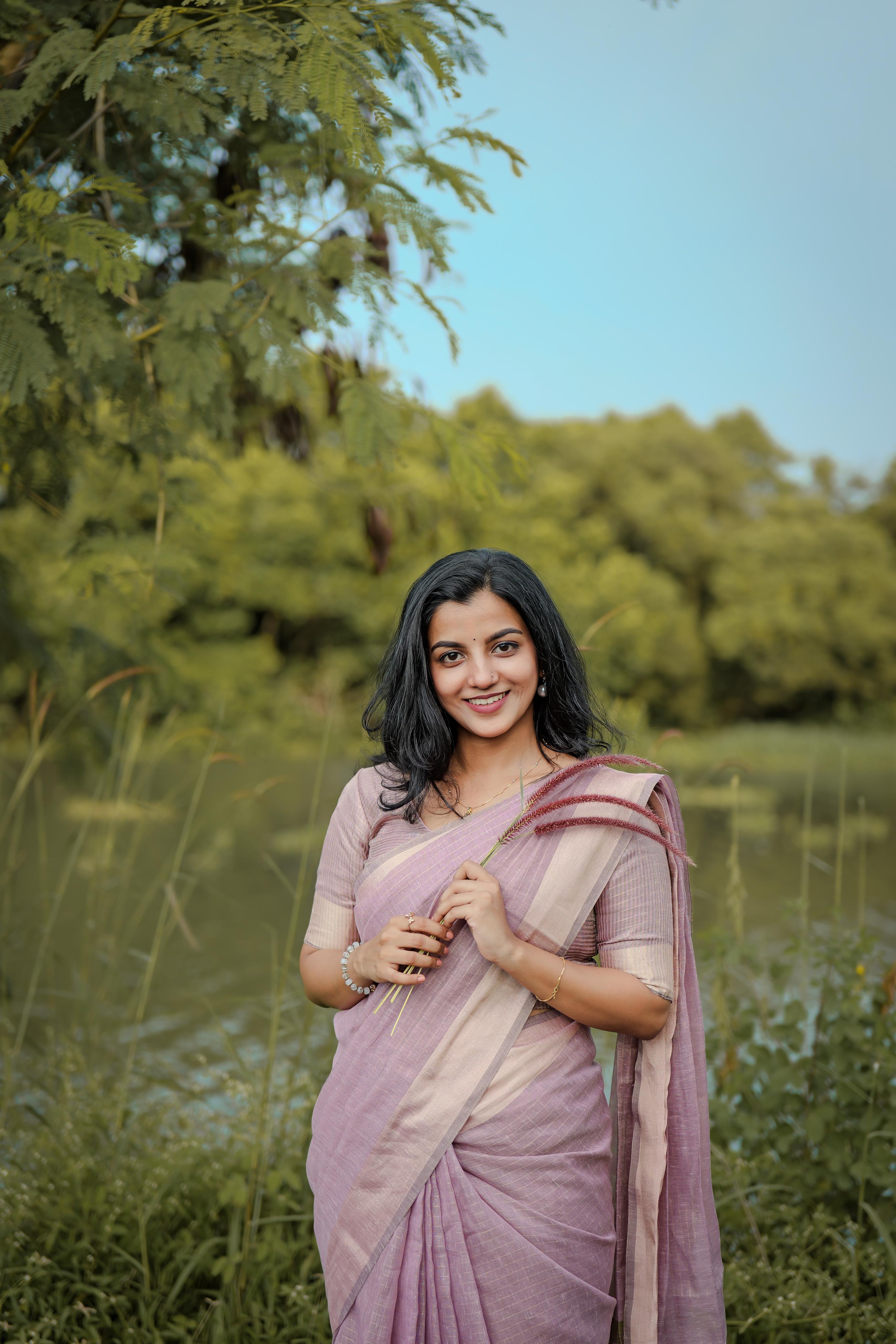 Tissue checks pastel shade saree with tussles