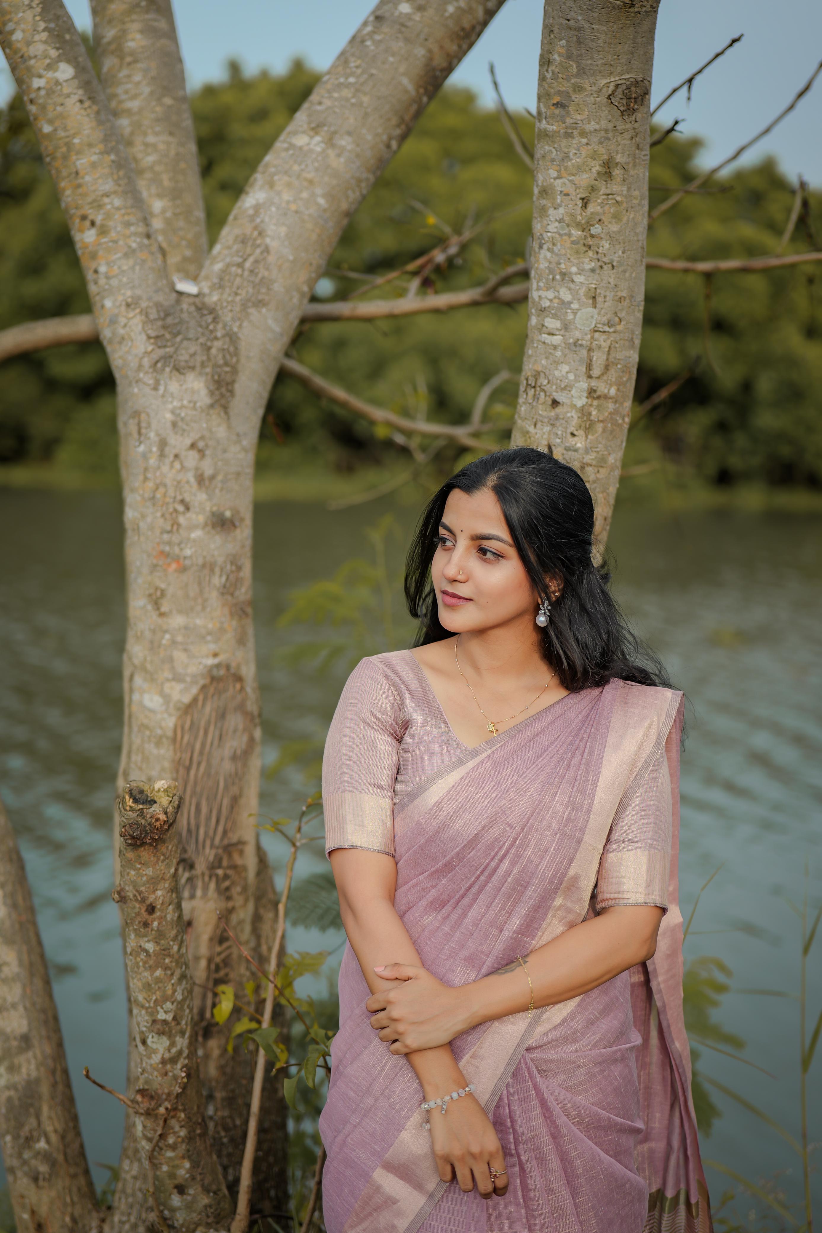 Tissue checks pastel shade saree with tussles